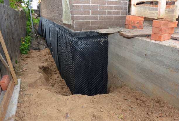 Happy homeowners after waterproofing job in Old Westbury